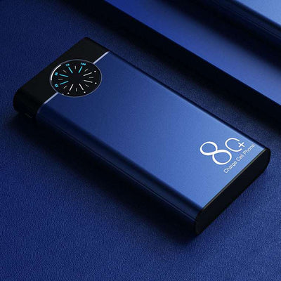 Blue fast charging mobile power supply with digital display on blue surface