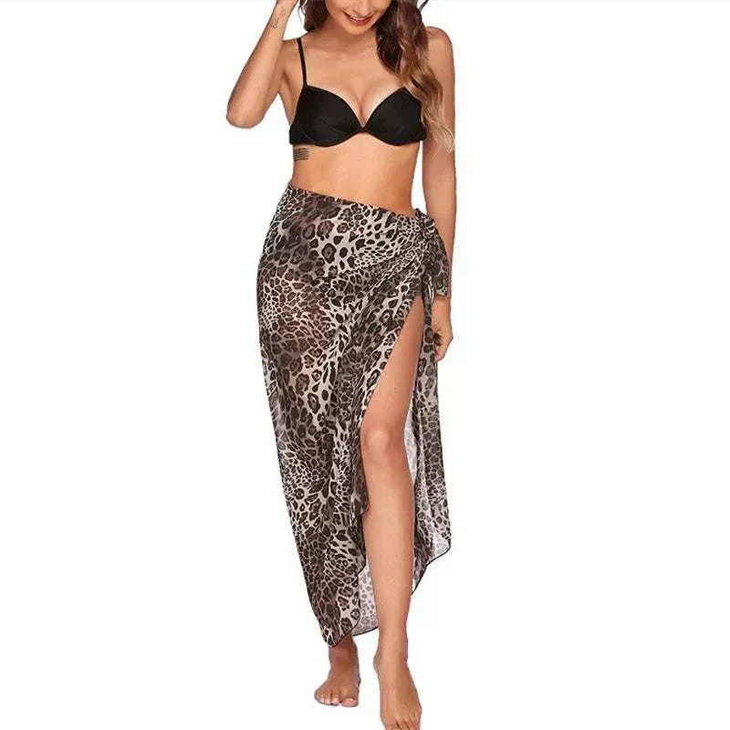 Woman wearing leopard print chiffon beach skirt with black bikini top beach skirt women