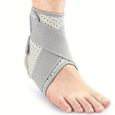 Grey ankle brace with adjustable straps worn on foot for sprained ankle support