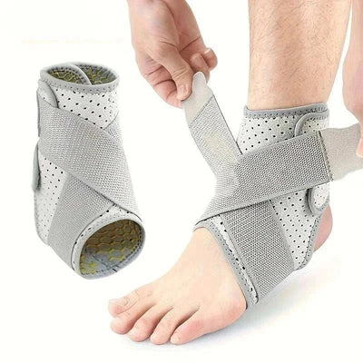 Adjustable gray ankle brace for sprained ankle with breathable perforated material and supportive straps