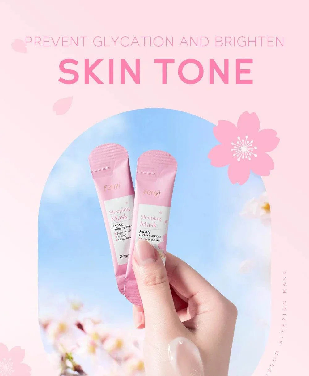 Hand holding Sakura Moisturizing Sleeping Masks travel-sized pink packets against blue sky background with cherry blossom flowers
