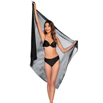 Women wearing black chiffon beach skirt wrap as beach wear